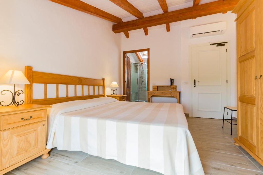 Postel nebo postele na pokoji v ubytování Villa Brigida