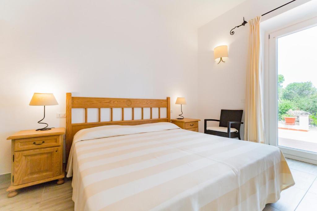 Postel nebo postele na pokoji v ubytování Villa Brigida