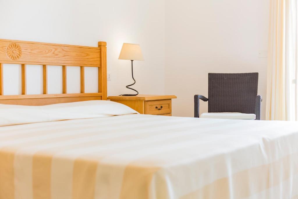 Postel nebo postele na pokoji v ubytování Villa Brigida