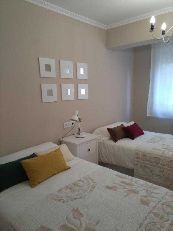 Posteľ alebo postele v izbe v ubytovaní Torre Center II