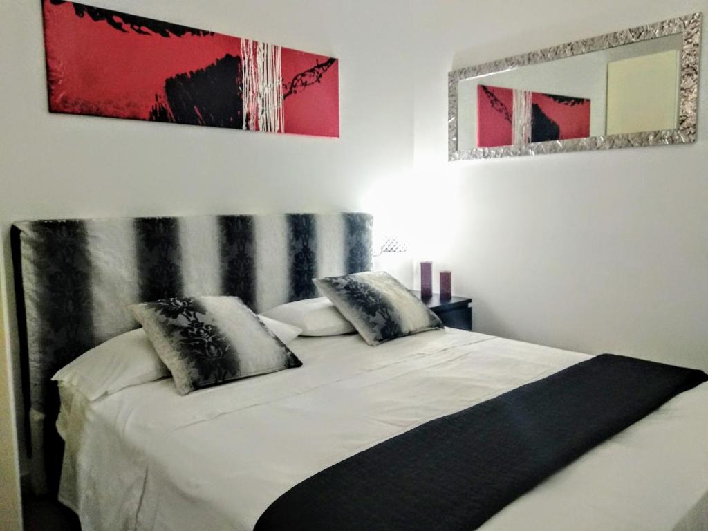 Postel nebo postele na pokoji v ubytování Bell'House Milazzo