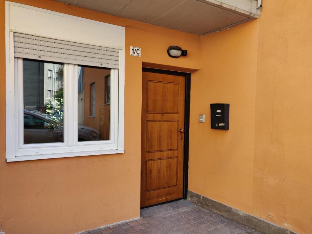 a door and a window on the side of a building at Tridentum in Trento
