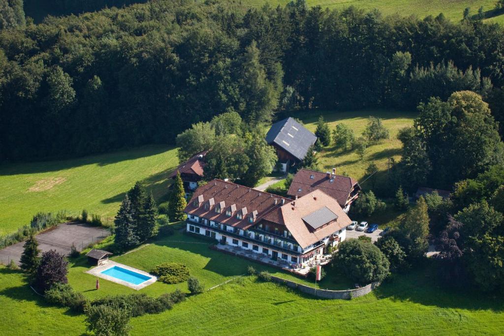 an aerial view of a large house with a swimming pool at Hotel Schöne Aussicht in Salzburg