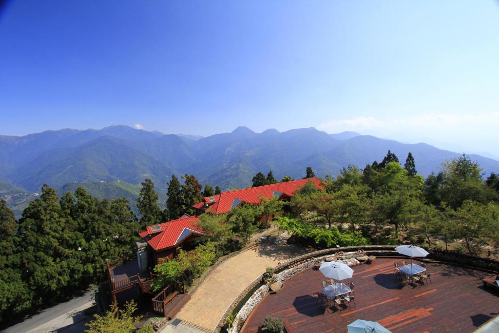 an aerial view of a resort with mountains in the background at Ailiga Travel Villa in Ren&#39;ai