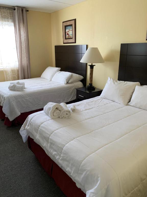 Postel nebo postele na pokoji v ubytování Sandy Shores Resort