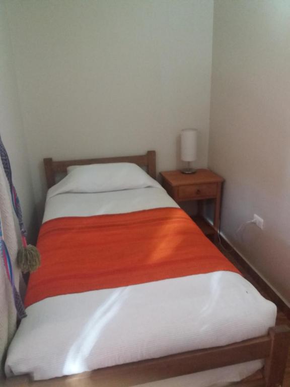 Postel nebo postele na pokoji v ubytování Hostal Nuevo Amanecer