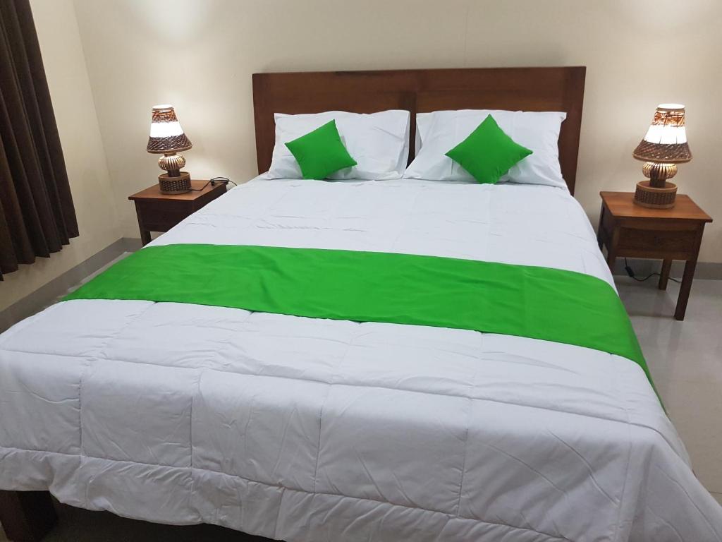 Postel nebo postele na pokoji v ubytování Gusti Room
