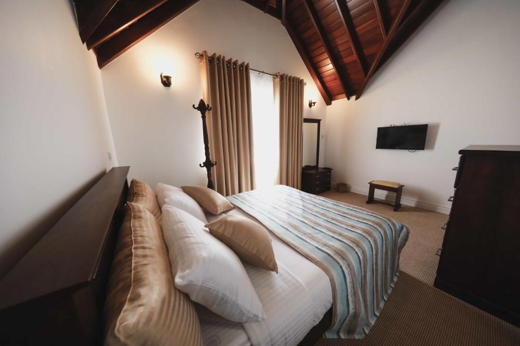 Posteľ alebo postele v izbe v ubytovaní Stratford Cottage - Nuwara Eliya