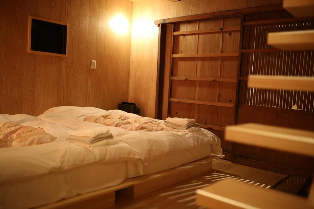 Postel nebo postele na pokoji v ubytování 無鹿リゾート