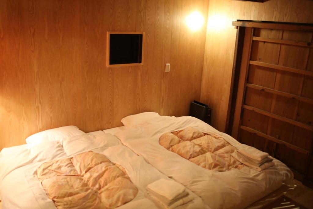Postel nebo postele na pokoji v ubytování 無鹿リゾート