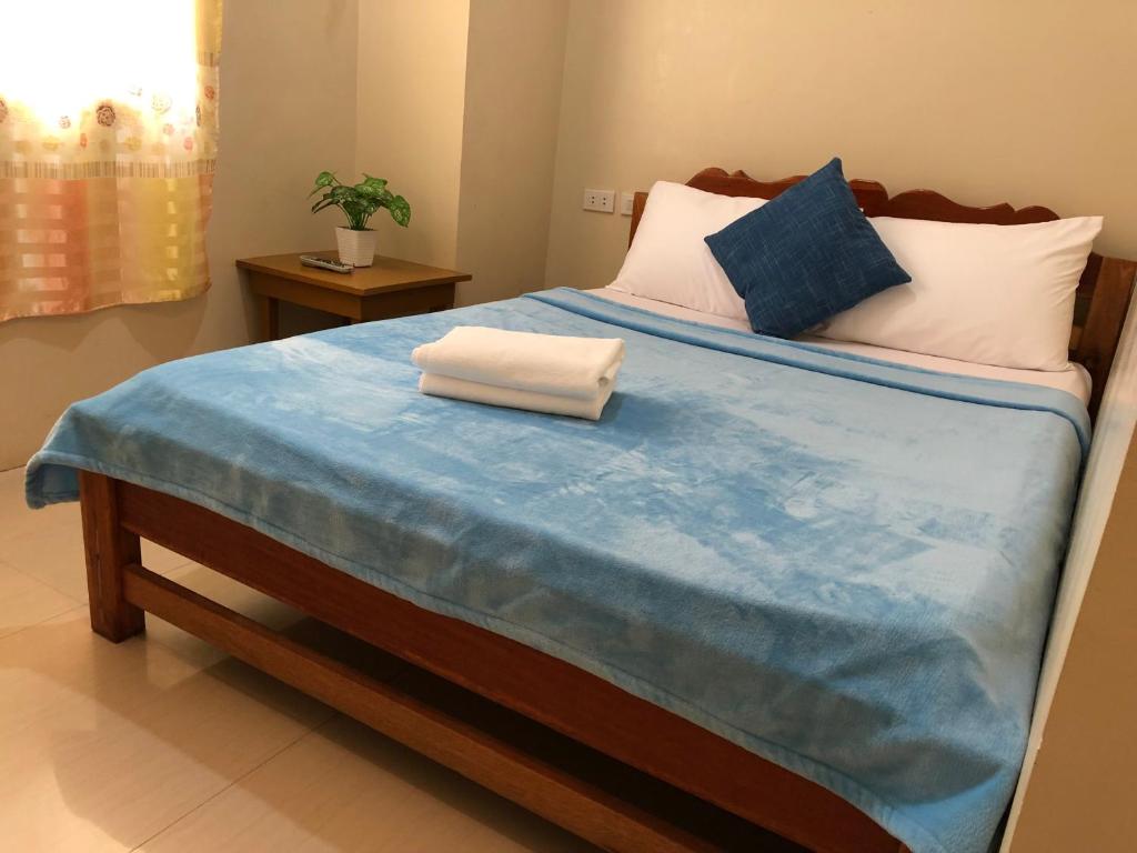Postel nebo postele na pokoji v ubytování Boracay Backpackers