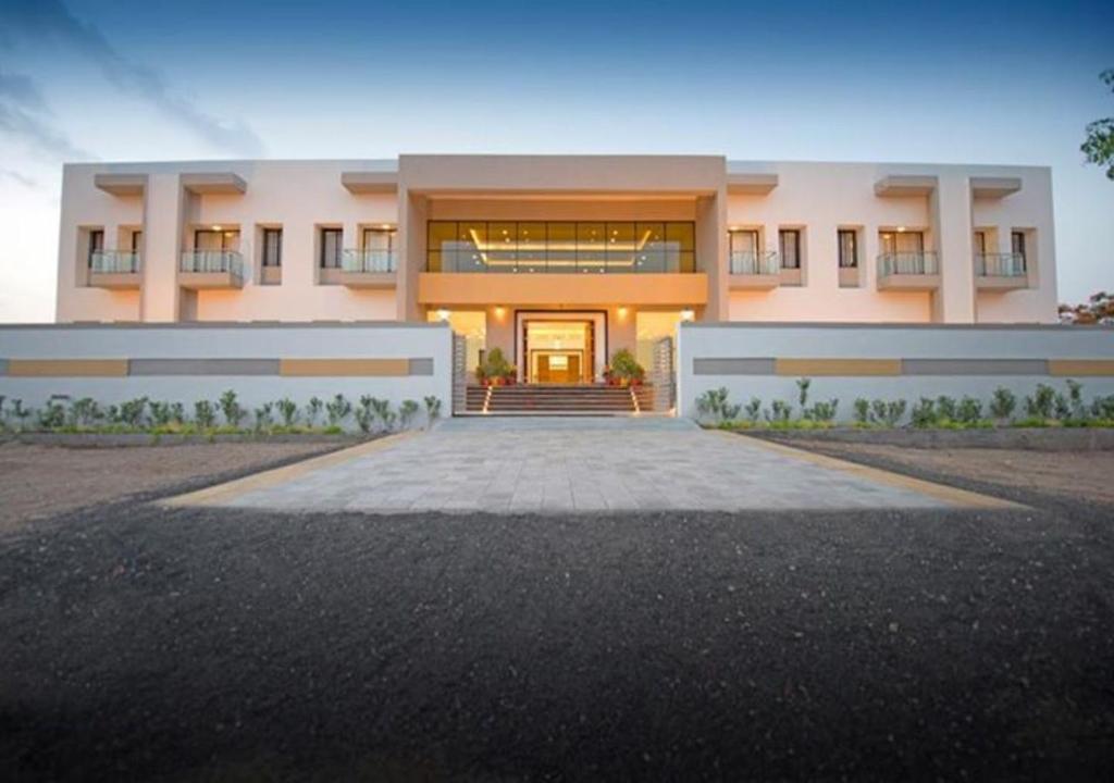 a rendering of a house with a driveway at Hotel President Banquet & Lawn in Aurangabad