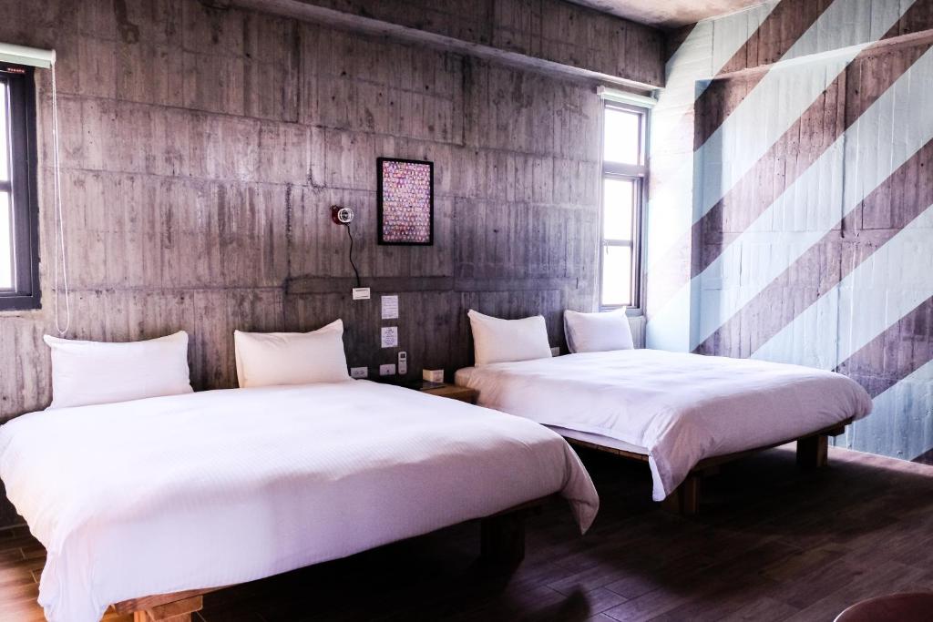 Postel nebo postele na pokoji v ubytování Relaxing Hotel