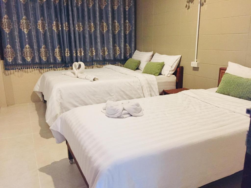 Postel nebo postele na pokoji v ubytování Nett Hotel