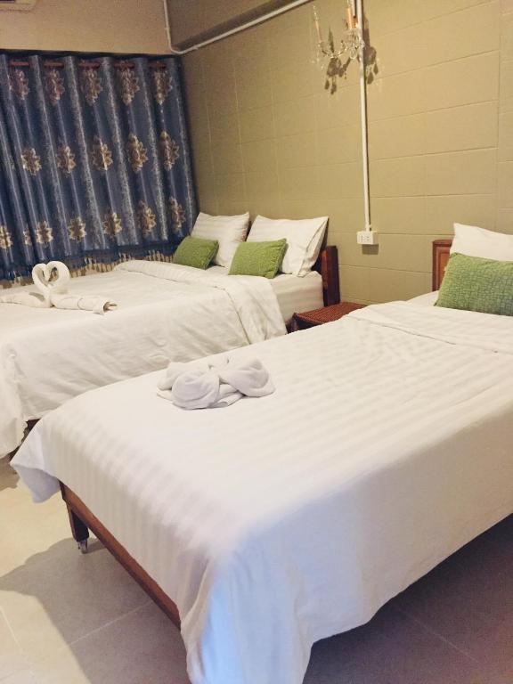 Postel nebo postele na pokoji v ubytování Nett Hotel