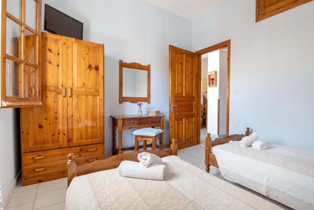 Postel nebo postele na pokoji v ubytování Voula Apartments