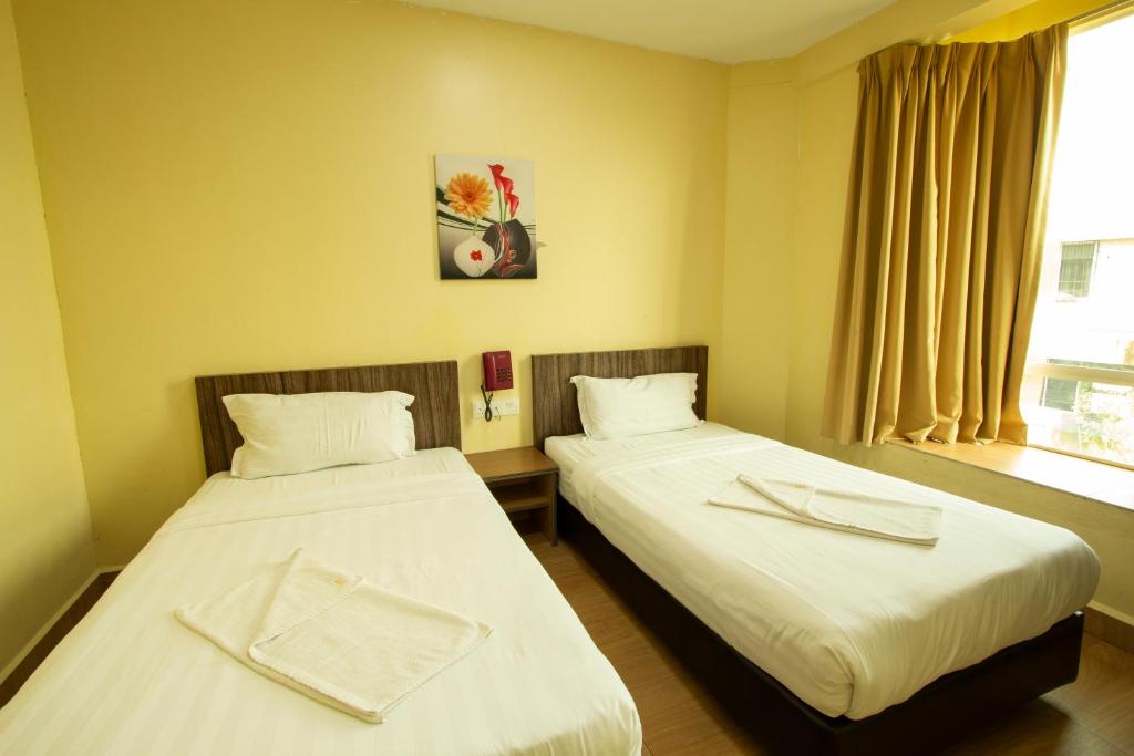 Postel nebo postele na pokoji v ubytování Expo Hotel