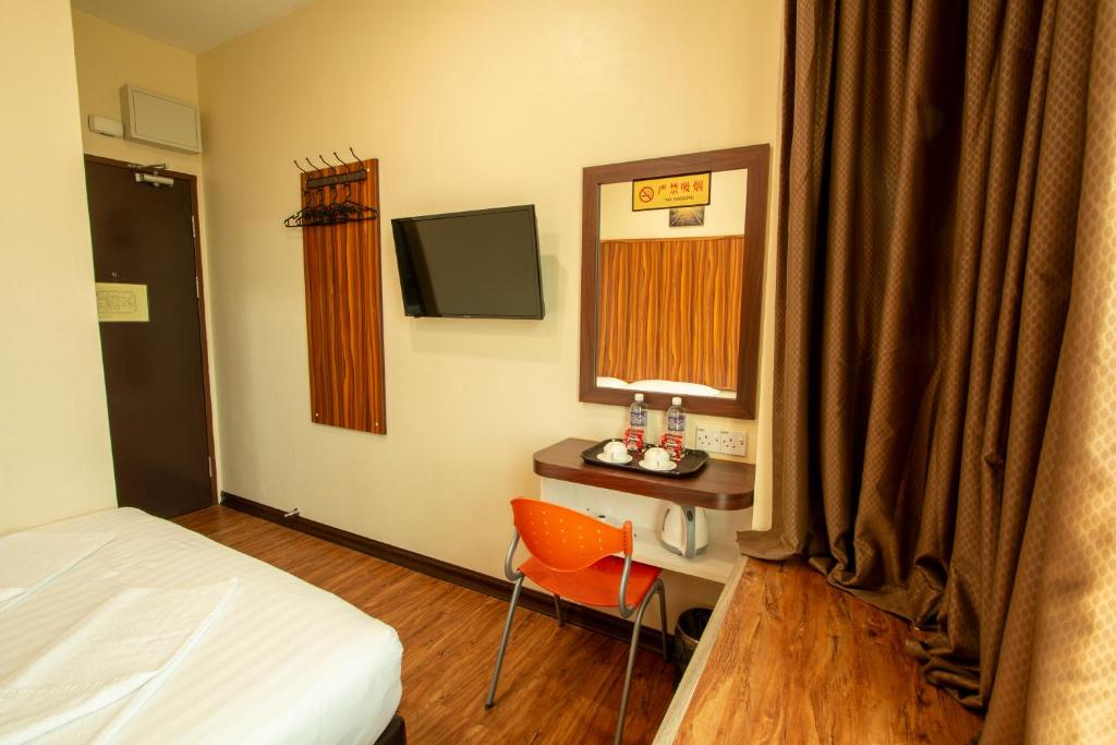 TV a/nebo společenská místnost v ubytování Expo Hotel