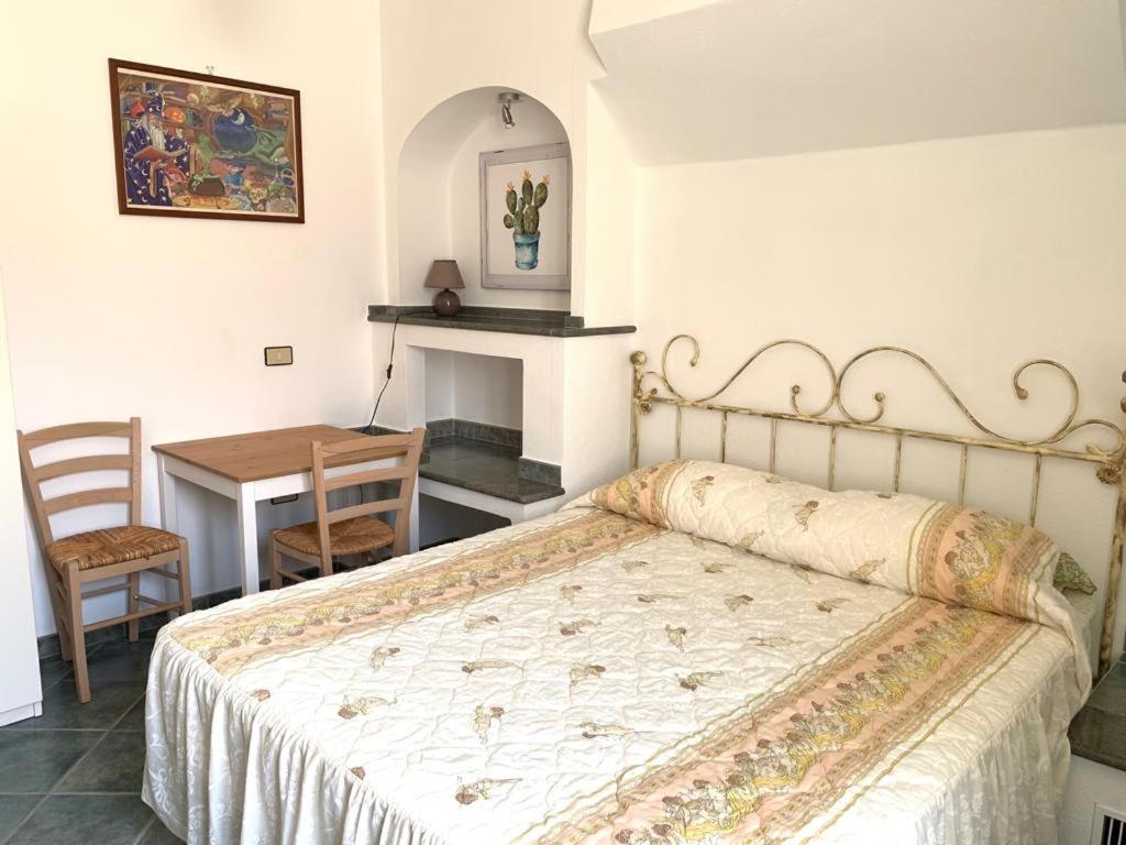 Postel nebo postele na pokoji v ubytování B&B S'Incontru