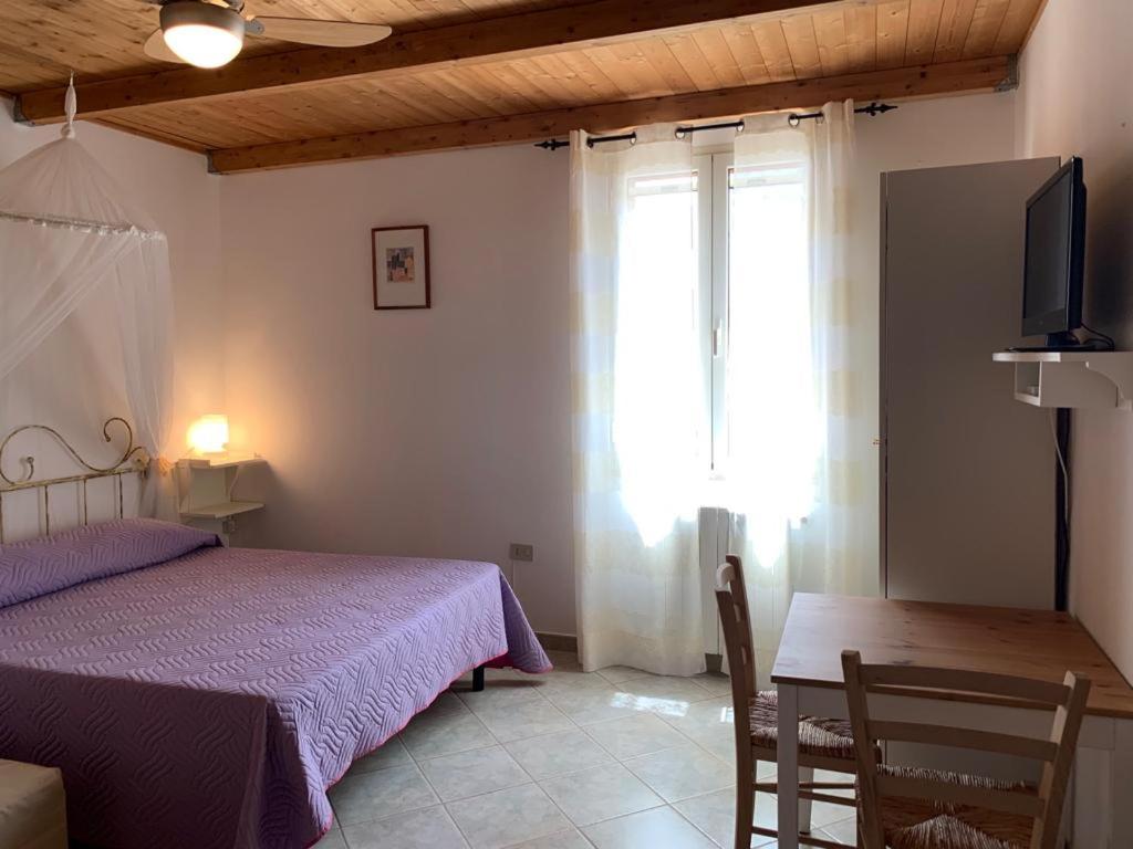 Postel nebo postele na pokoji v ubytování B&B S'Incontru