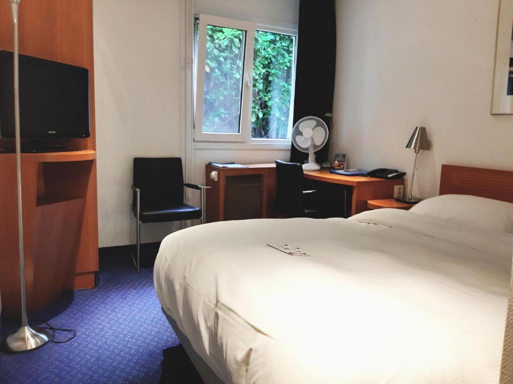 Postel nebo postele na pokoji v ubytování Fletcher Resort-Hotel Zutphen