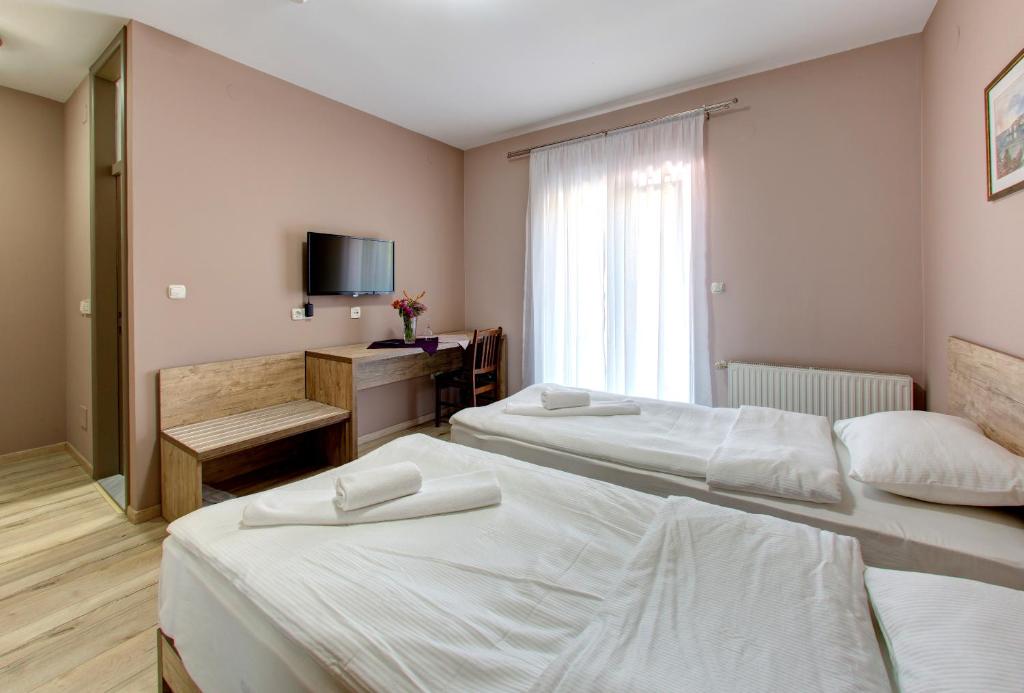 Postel nebo postele na pokoji v ubytování Motel MontaNaro