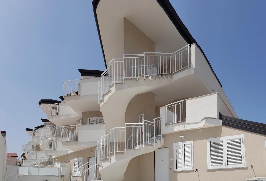 a building with balconies on the side of it at Punto Blu Relax in Agropoli