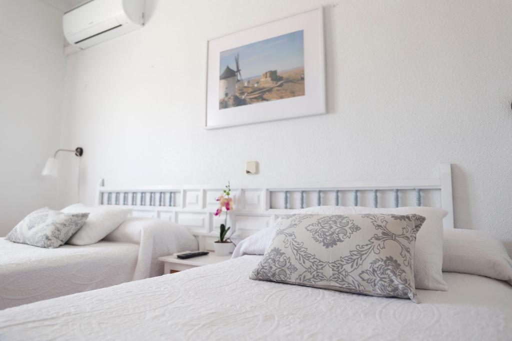 Postel nebo postele na pokoji v ubytování Hotel Consuegra