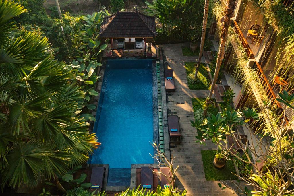 an overhead view of a swimming pool in a resort at Alam Terrace Cottages in Ubud