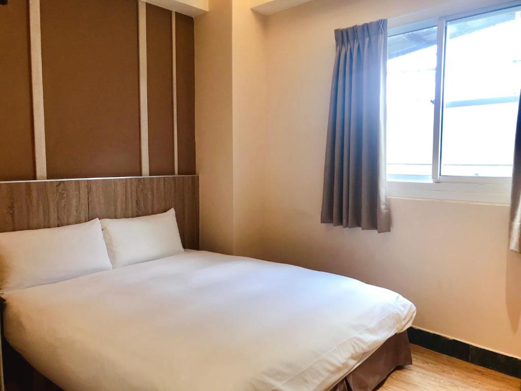 Postel nebo postele na pokoji v ubytování Prince Hotel