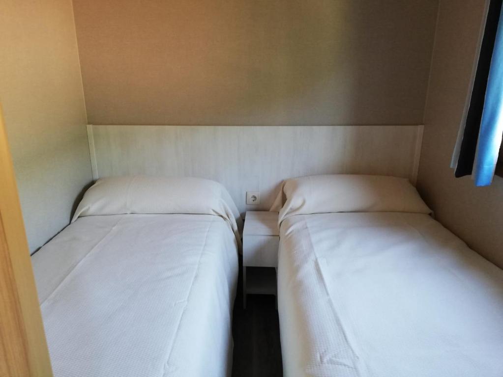 Postel nebo postele na pokoji v ubytování Panticosa Lodge