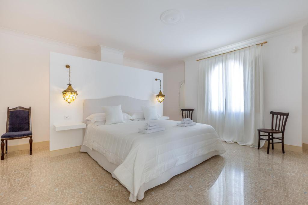 Postel nebo postele na pokoji v ubytování Relais Carlo Alberto