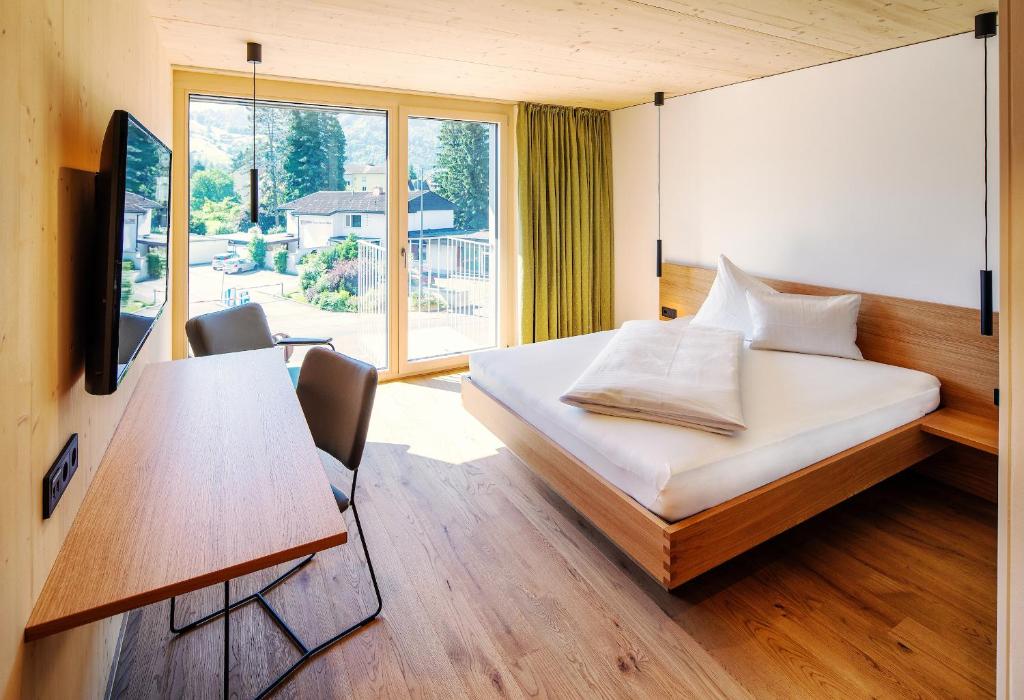 Postel nebo postele na pokoji v ubytování Hotel Krone