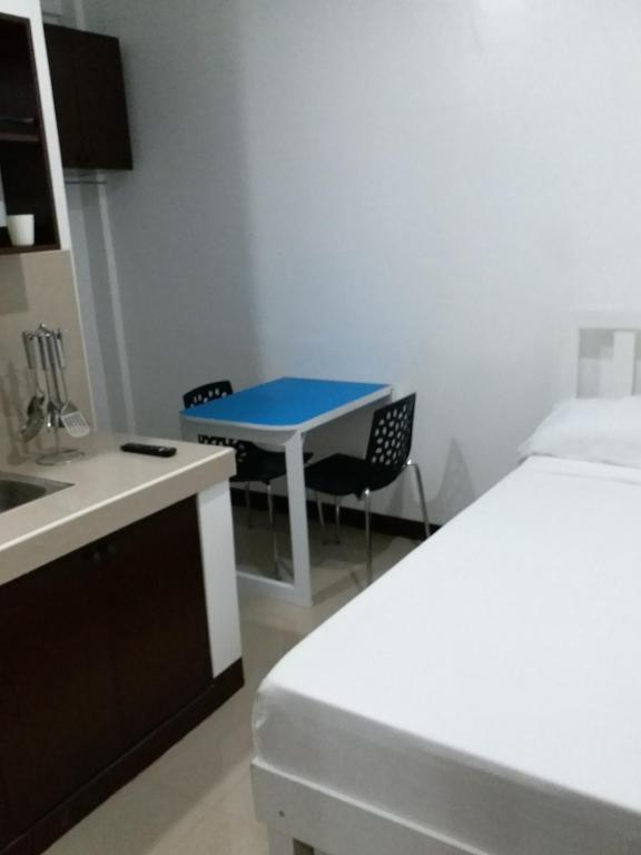 Postel nebo postele na pokoji v ubytování Clark-Pad Inn, Angeles City