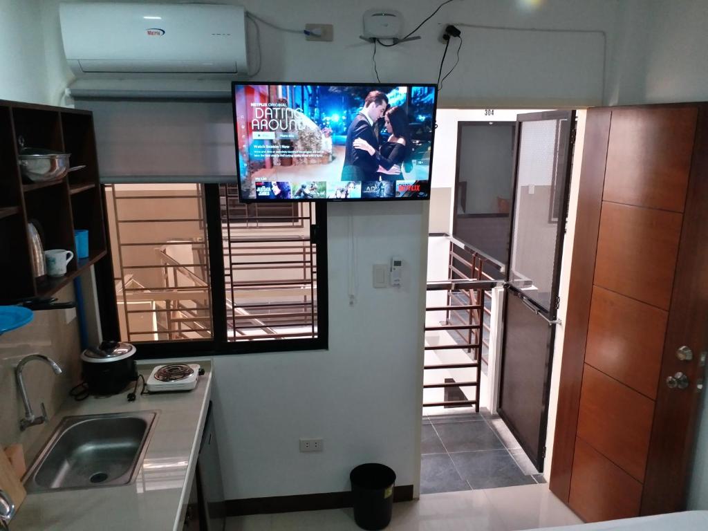 TV a/nebo společenská místnost v ubytování Clark-Pad Inn, Angeles City