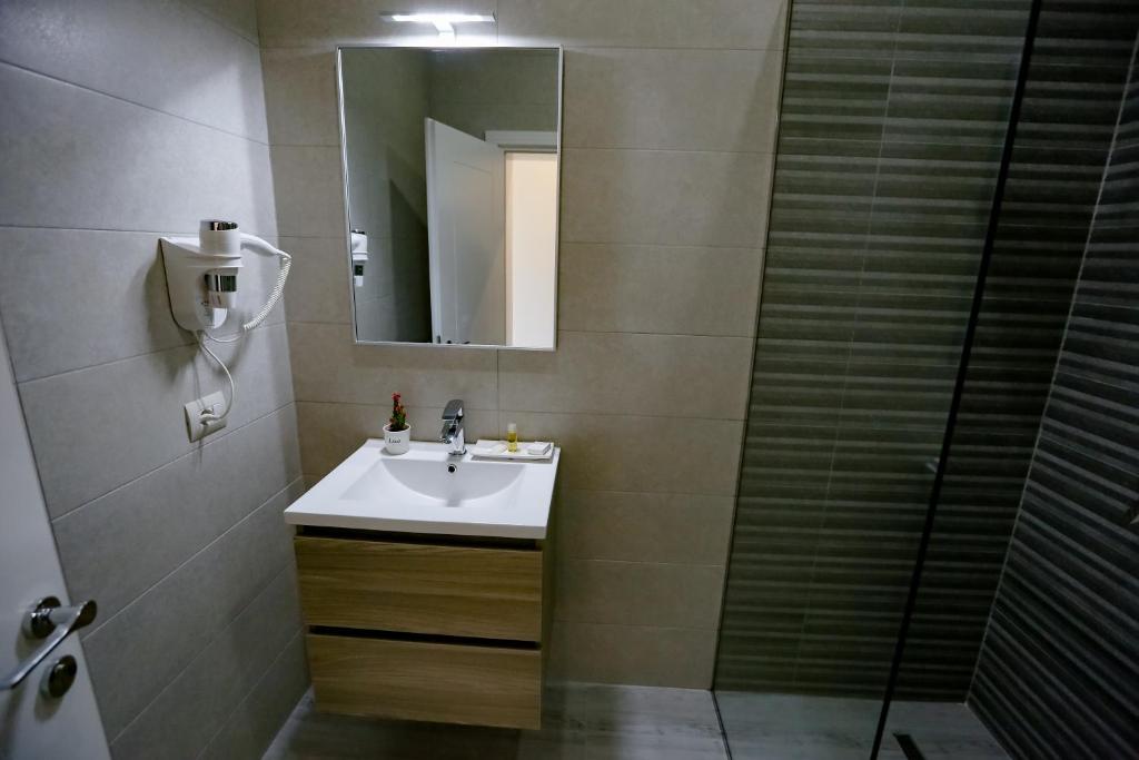 Koupelna v ubytování Home Hotel