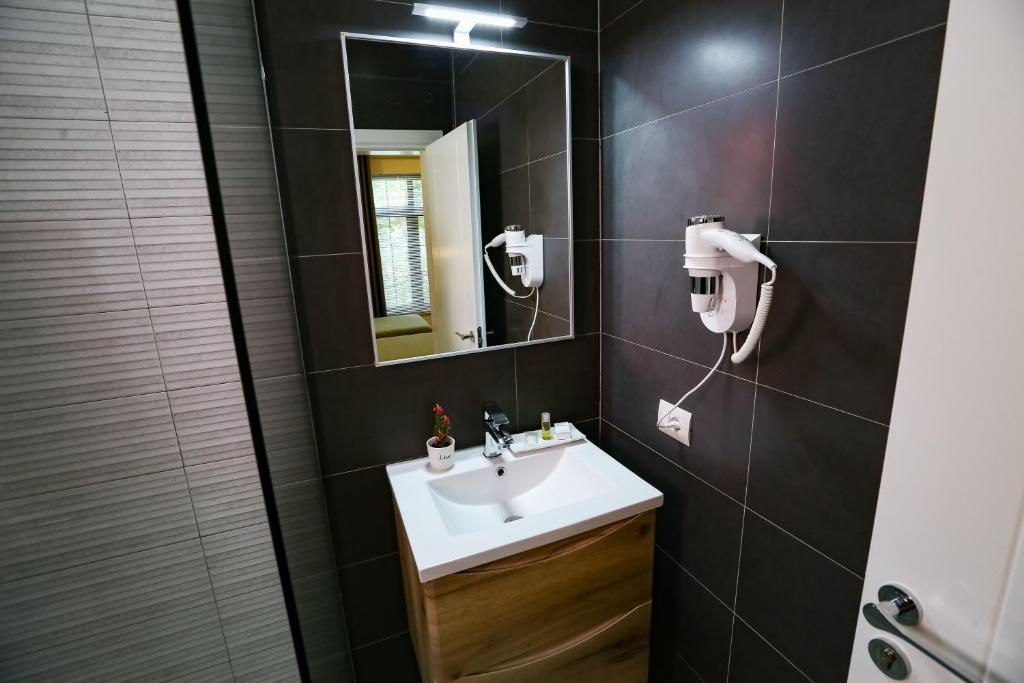 Koupelna v ubytování Home Hotel