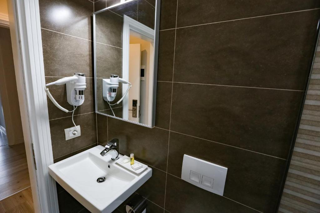 Koupelna v ubytování Home Hotel