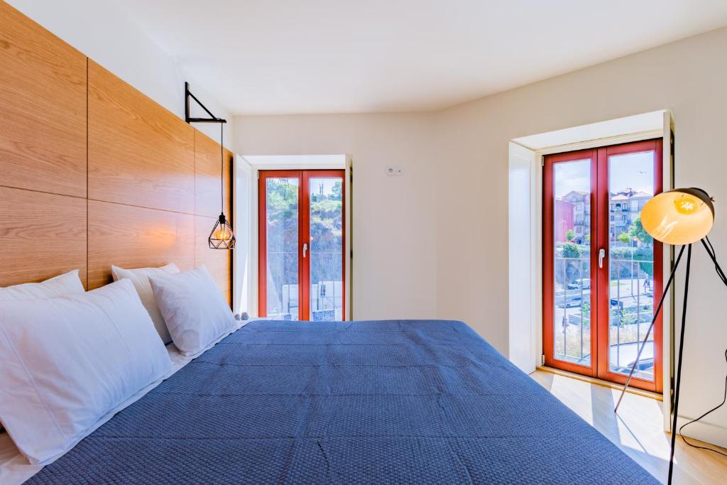 Postel nebo postele na pokoji v ubytování Porto Apartments - Sé