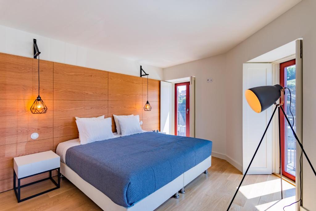Giường trong phòng chung tại Porto Apartments - Sé