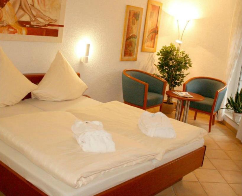 Postel nebo postele na pokoji v ubytování Hostellerie Bacher