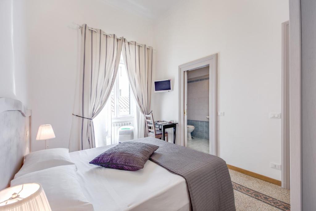 Postel nebo postele na pokoji v ubytování Biancorèroma B&B