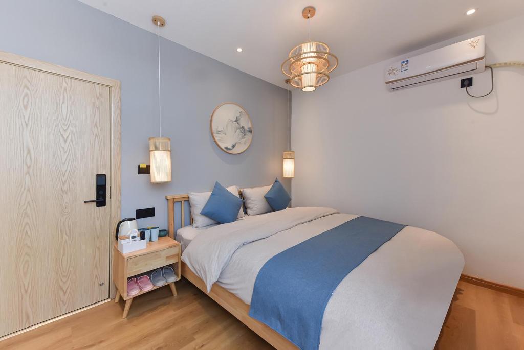 Postel nebo postele na pokoji v ubytování Yifangyan - Tingyuan Qingshe Hostel