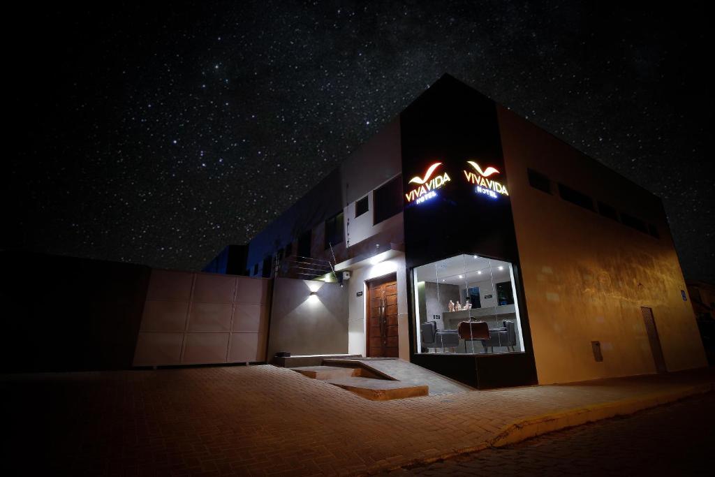 a building at night with a starry sky at Hotel Viva Vida in São Borja