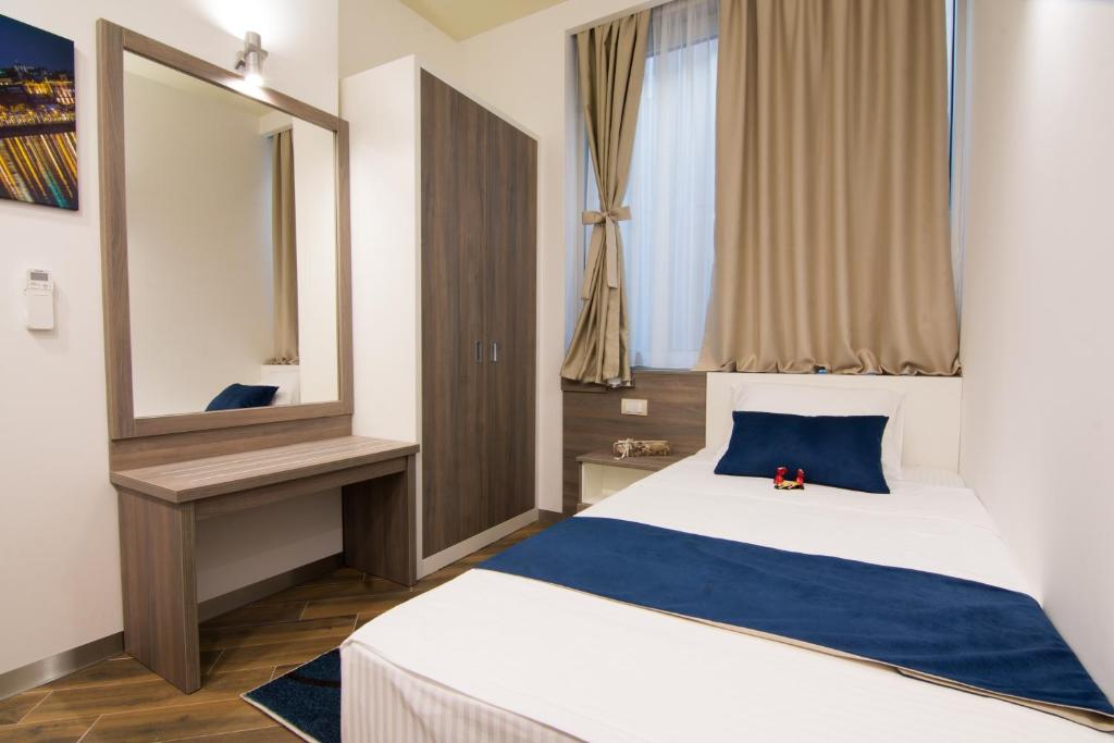 Postel nebo postele na pokoji v ubytování Omia