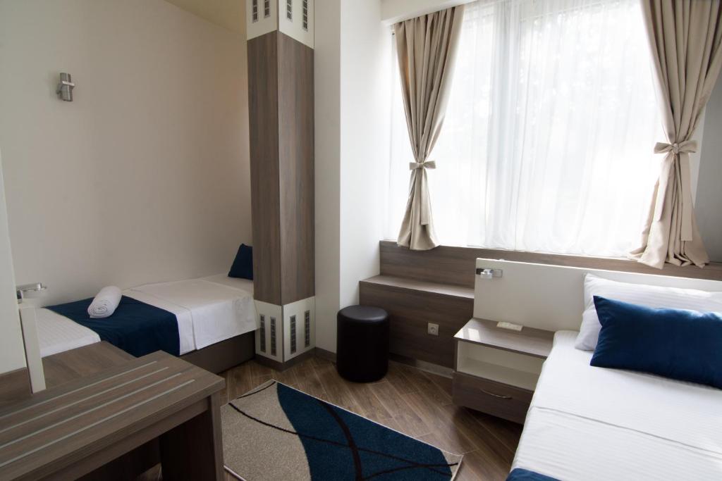 Postel nebo postele na pokoji v ubytování Omia