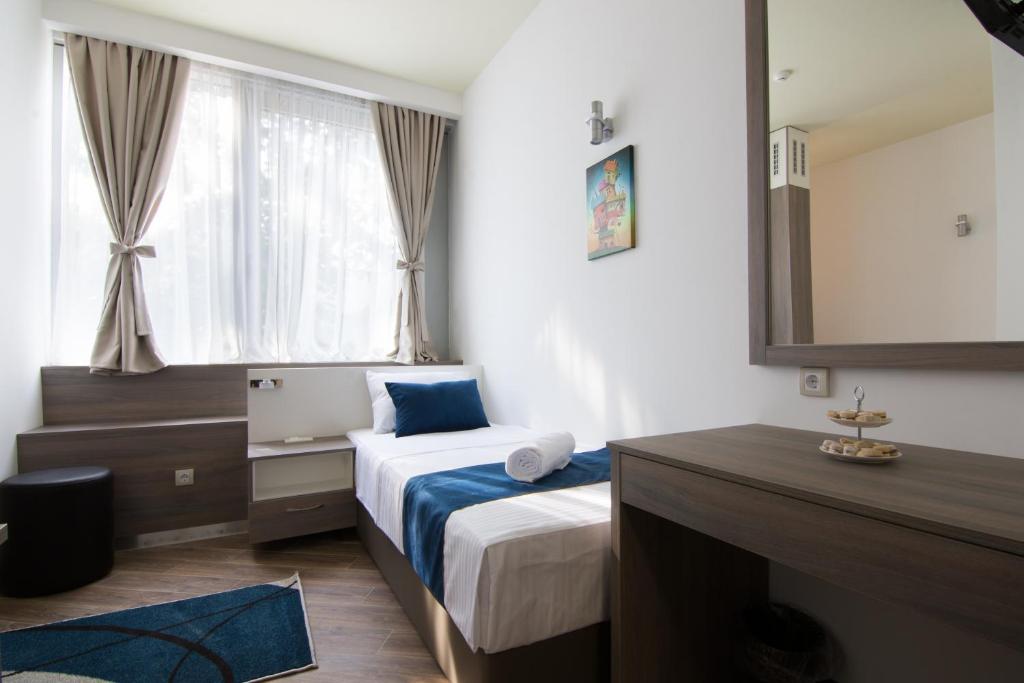 Postel nebo postele na pokoji v ubytování Omia