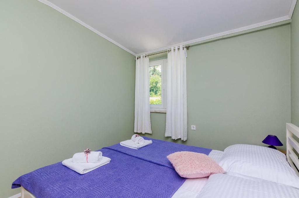 Postel nebo postele na pokoji v ubytování Villa Three Olives
