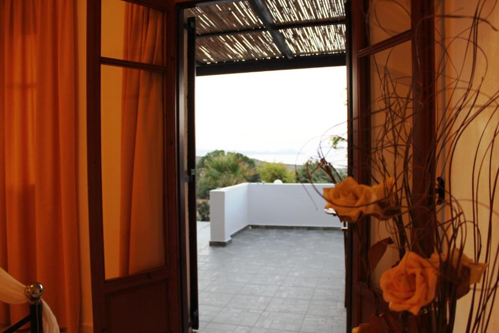 an open door with a view of a patio at Galini in Agia Irini Milos