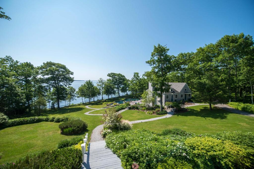 an aerial view of a house with a garden at The Inn at Ocean's Edge in Lincolnville